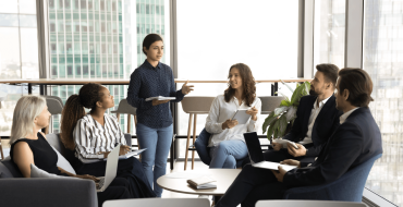 Community of young professional engaging in conversation