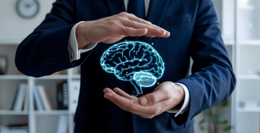 Mans hands around digital brain symbolizing mental health
