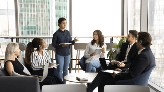 Community of young professional engaging in conversation