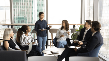 Community of young professional engaging in conversation